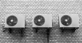 Three Air Conditioners on Brick Wall Black and White