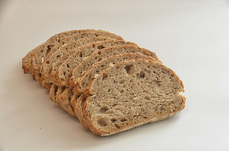 Sliced Whole Grain Bread on White Background