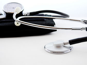 Stethoscope and Blood Pressure Monitor on White Background