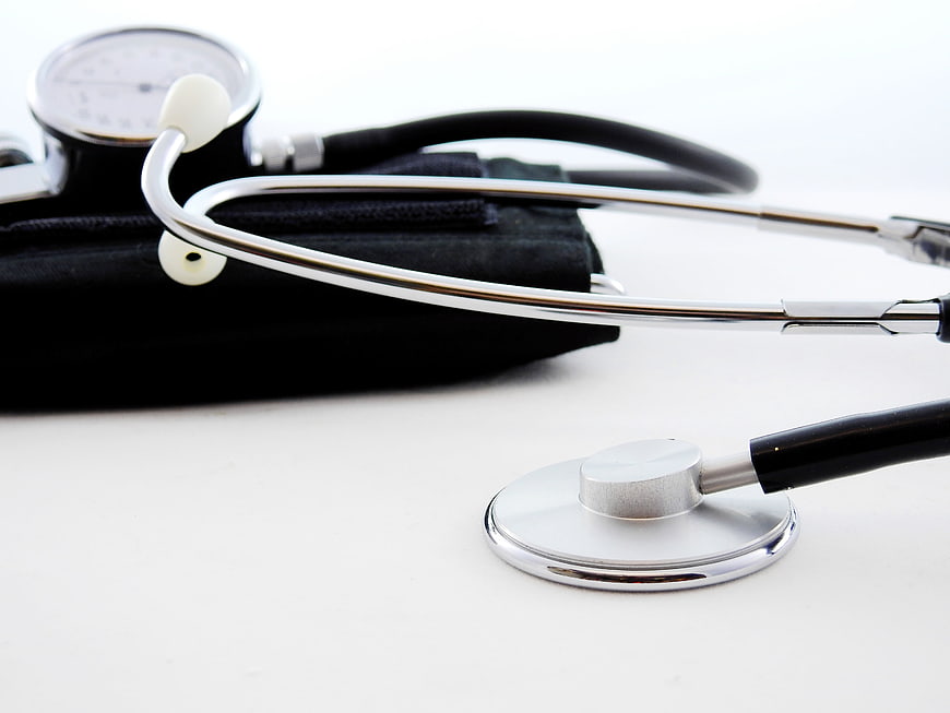 Stethoscope and Blood Pressure Monitor on White Background
