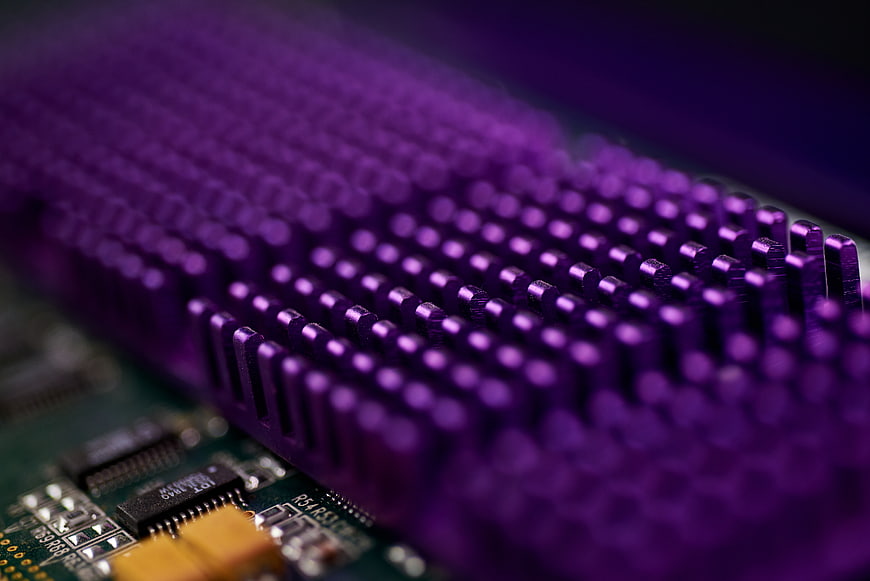 Macro shot of purple computer heat sink on motherboard