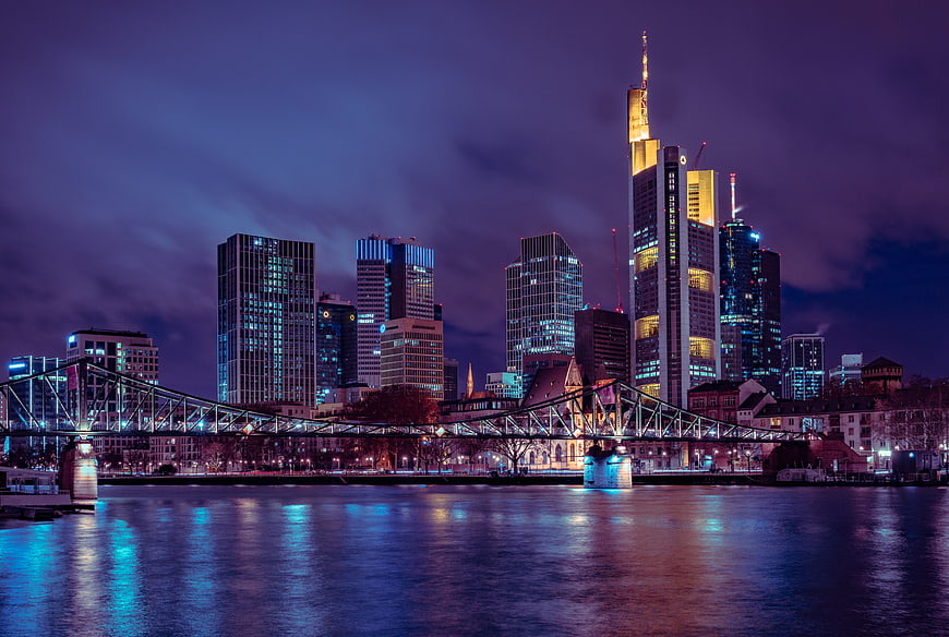 Frankfurt Skyline at Night with Main River Reflections and Bridge