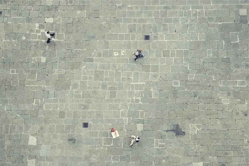 Aerial View of Pedestrians Walking on Stone Paved Plaza