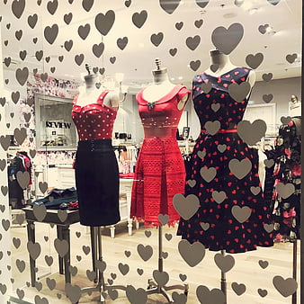 Valentine's Day Fashion Window Display with Red and Black Dresses