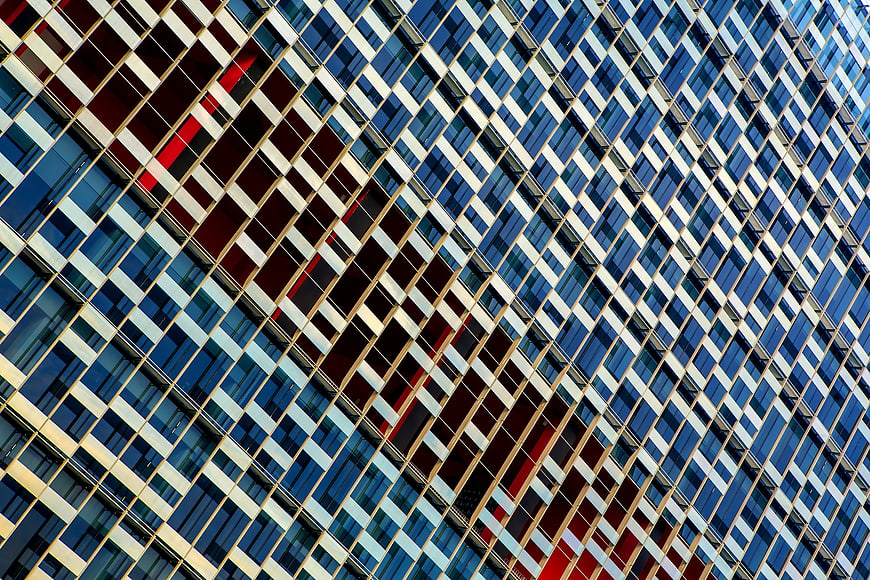 Abstract Modern Glass Building Facade with Red Accents