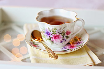 Vintage Floral Teacup with Gold Spoon on Napkin