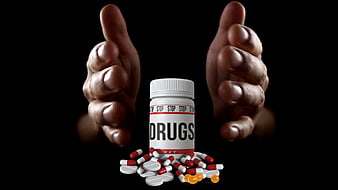 Hands Reaching For Prescription Drug Bottle And Pills On Black Background