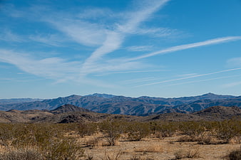Scenic desert landscape with mountains and blue sky