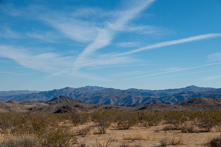Scenic desert landscape with mountains and blue sky