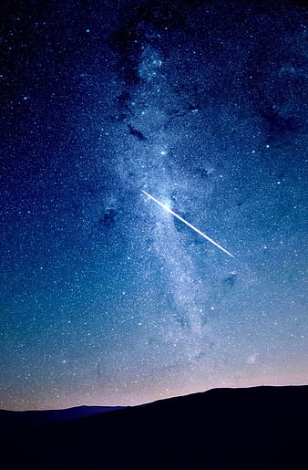 Milky Way Galaxy and Shooting Star Over Dark Horizon