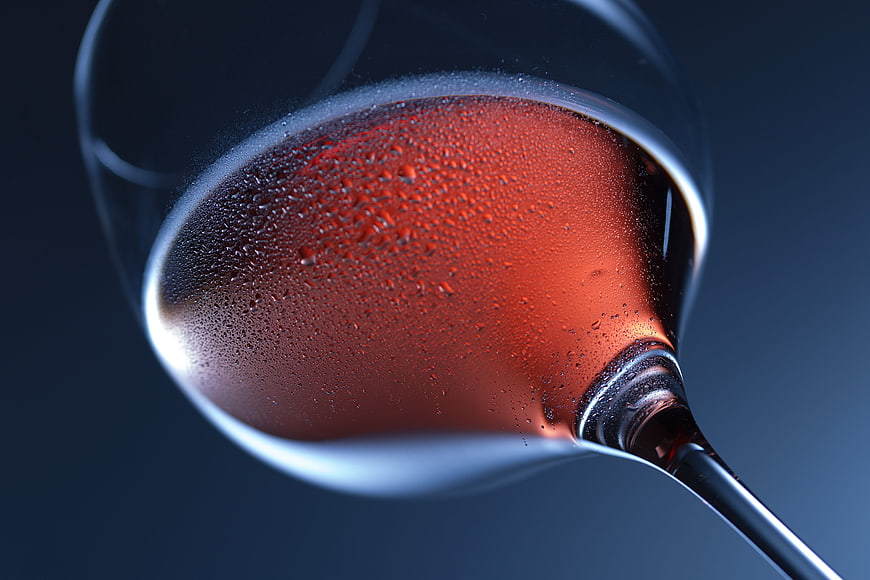 Close-up of red wine in a glass with condensation droplets