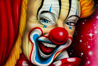 Close-up painting of a smiling clown face with red nose