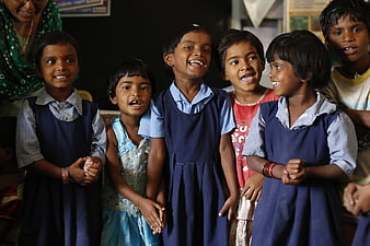 Group of smiling Indian school children in classroom