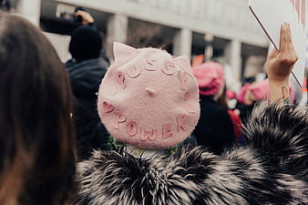Woman wearing pink pussy hat at protest rally