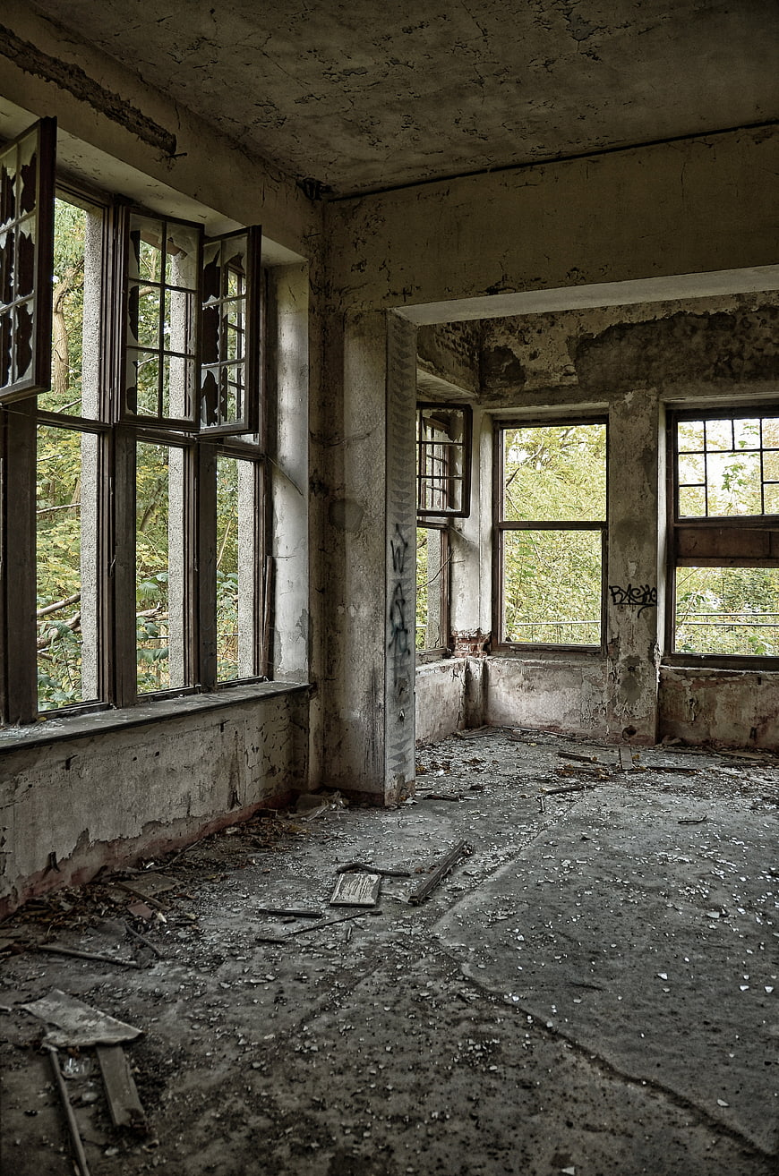 Abandoned Villa Interior With Peeling Walls And Broken Windows