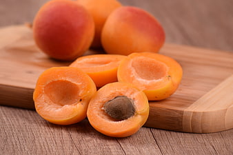Fresh Apricots on Wooden Cutting Board