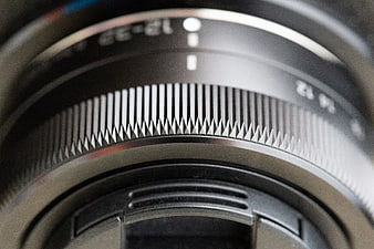 Close-up of camera lens focus ring texture and details