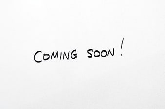 Handwritten Coming Soon Text On White Paper Background