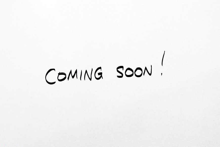 Handwritten Coming Soon Text On White Paper Background