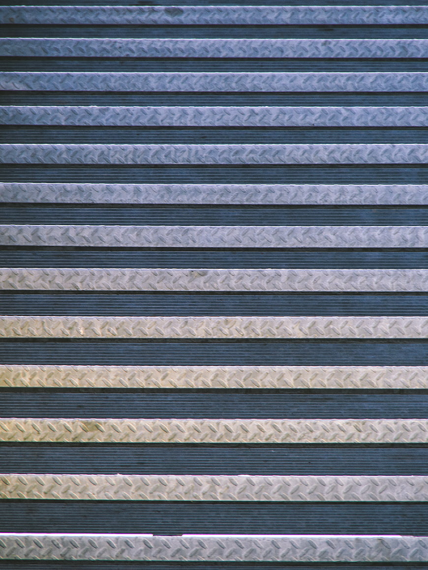 Abstract Metal Texture with Horizontal Stripes and Diamond Plate Pattern
