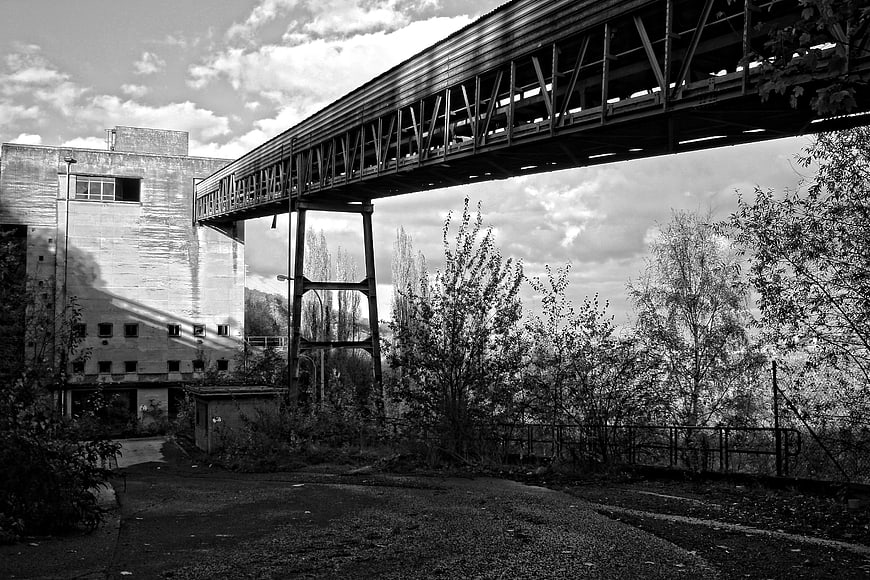 Abandoned industrial building with conveyor belt structure
