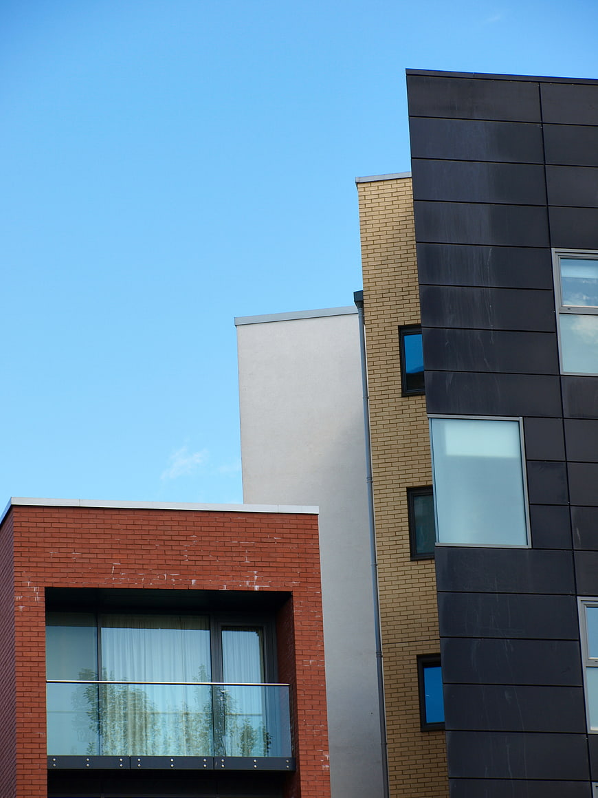 Modern Colorful Apartment Buildings Against Blue Sky