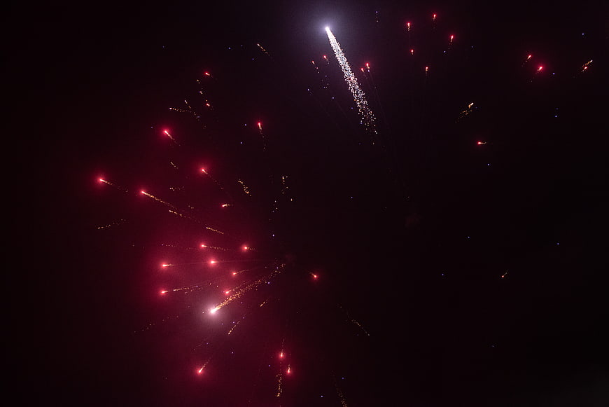 Red and Gold Fireworks Exploding in Night Sky