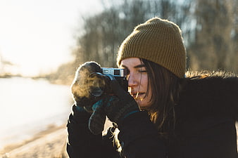 Woman Photographer Taking Photo in Winter Outdoors