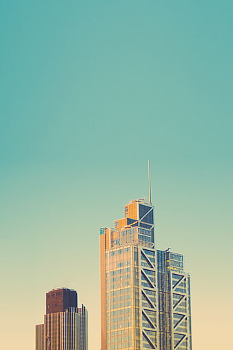Modern Skyscraper Against Teal Sky