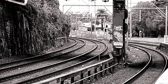 Curved Railway Tracks in Black and White Urban Landscape