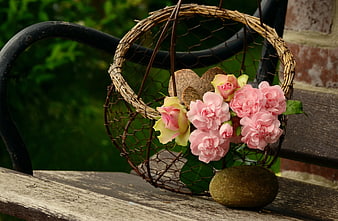 Pink Carnations and Roses in Rustic Wire Basket on Bench