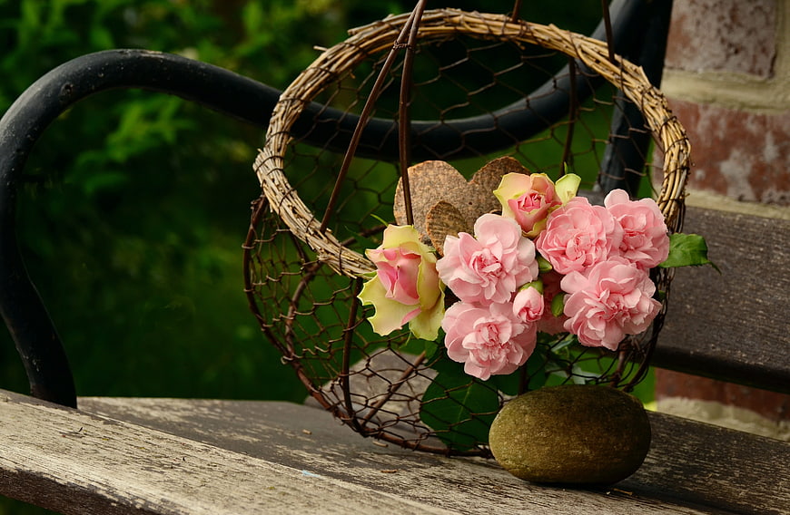 Pink Carnations and Roses in Rustic Wire Basket on Bench