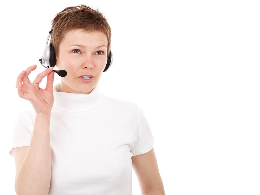 Female Customer Service Agent Wearing Headset On White Background