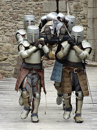 Medieval Knights Carrying Body On Wooden Deck