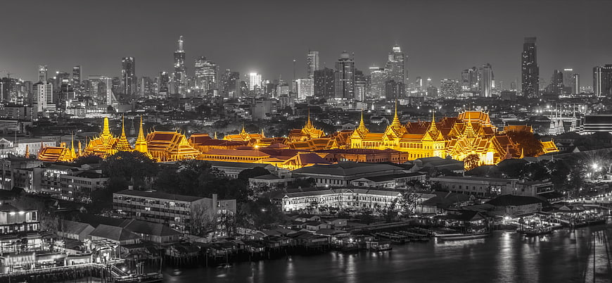 Bangkok Grand Palace Golden Rooftops Against Black and White Skyline