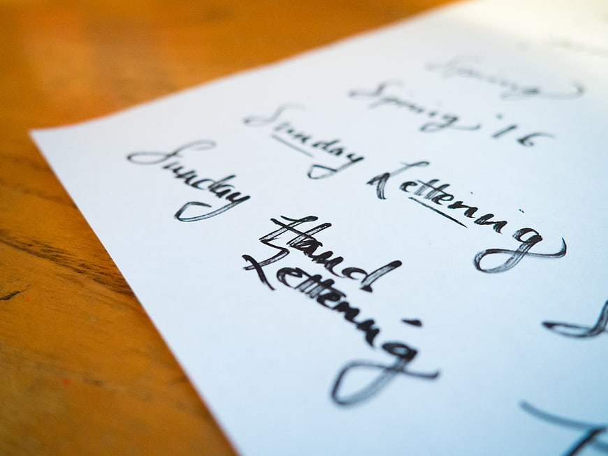 Handwritten Calligraphy Practice on White Paper