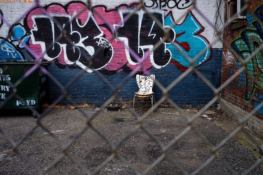 Graffiti Wall Seen Through Chain Link Fence