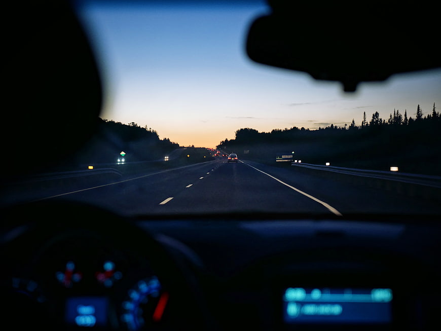 Driving on Highway at Dusk with Dashboard View