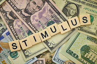 Stimulus word spelled with letter cubes on US dollar bills