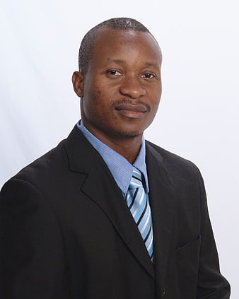 Professional African Businessman Portrait In Suit And Tie