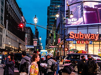 Busy Manhattan Street Scene at Dusk with Subway Entrance