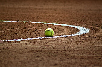 Green Tennis Ball on Clay Court White Line