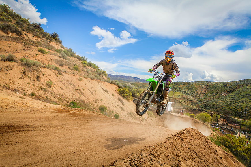 Motocross Rider Jumping Dirt Bike on Outdoor Track