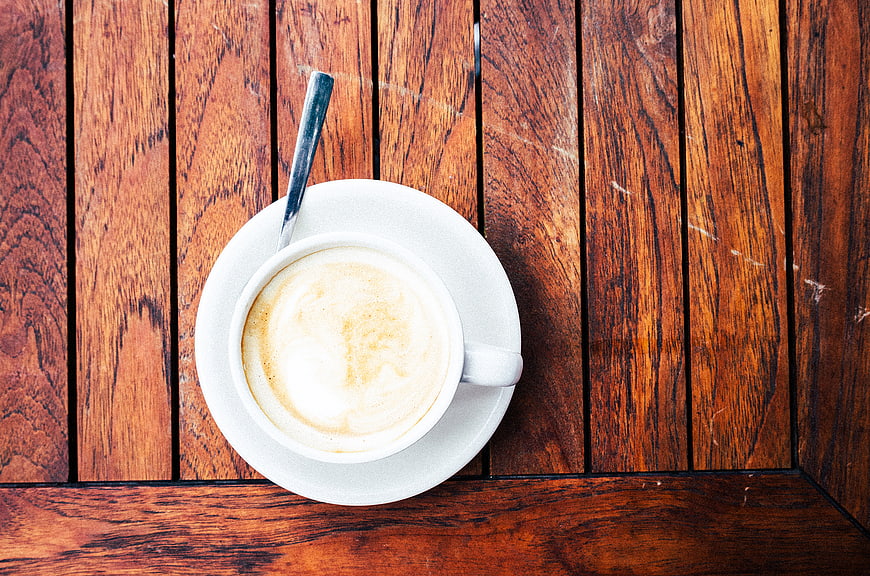 Top View of Cappuccino on Rustic Wooden Table