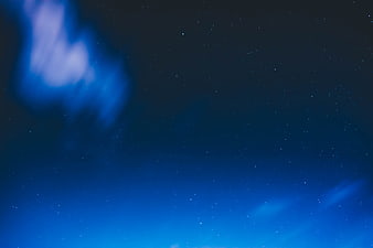 Blue Aurora Borealis and Stars in Night Sky