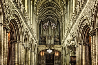 Gothic Cathedral Interior With Grand Pipe Organ And Arched Vaulting