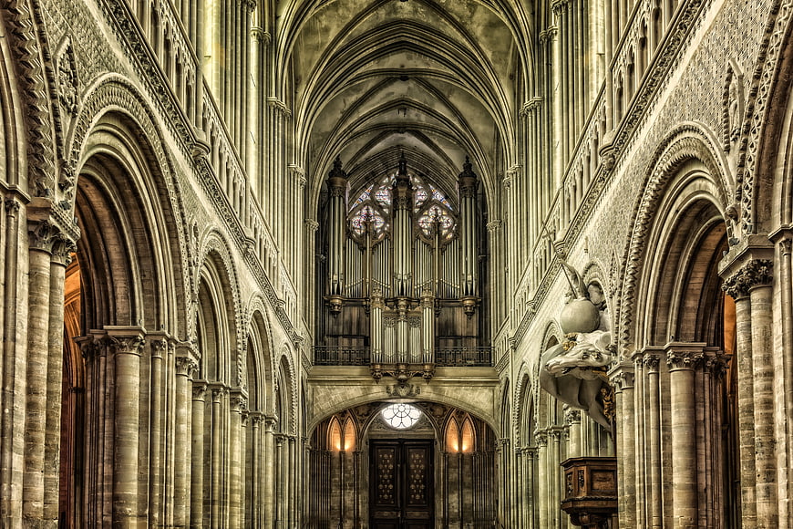 Gothic Cathedral Interior With Grand Pipe Organ And Arched Vaulting