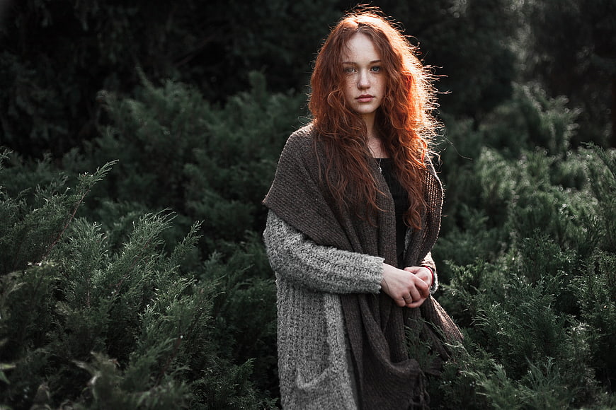 Portrait of Redhead Woman in Knitwear in Forest