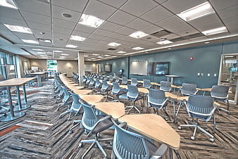 Modern Empty Classroom With Rows Of Desks And Chairs
