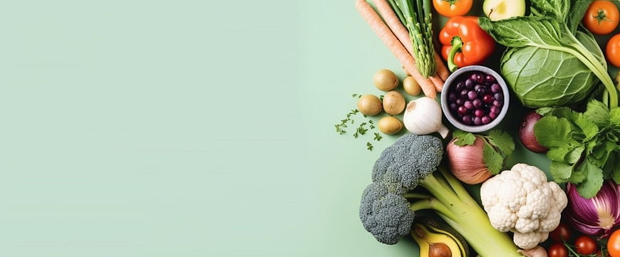 Fresh Organic Vegetables and Herbs Flat Lay on Mint Background